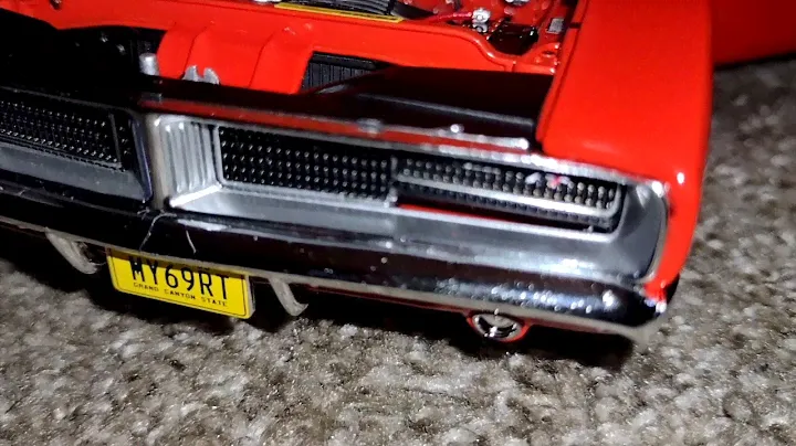 Unboxing of a 1 18 scale diecast of a 1969 dodge charger RT Red by Auto World